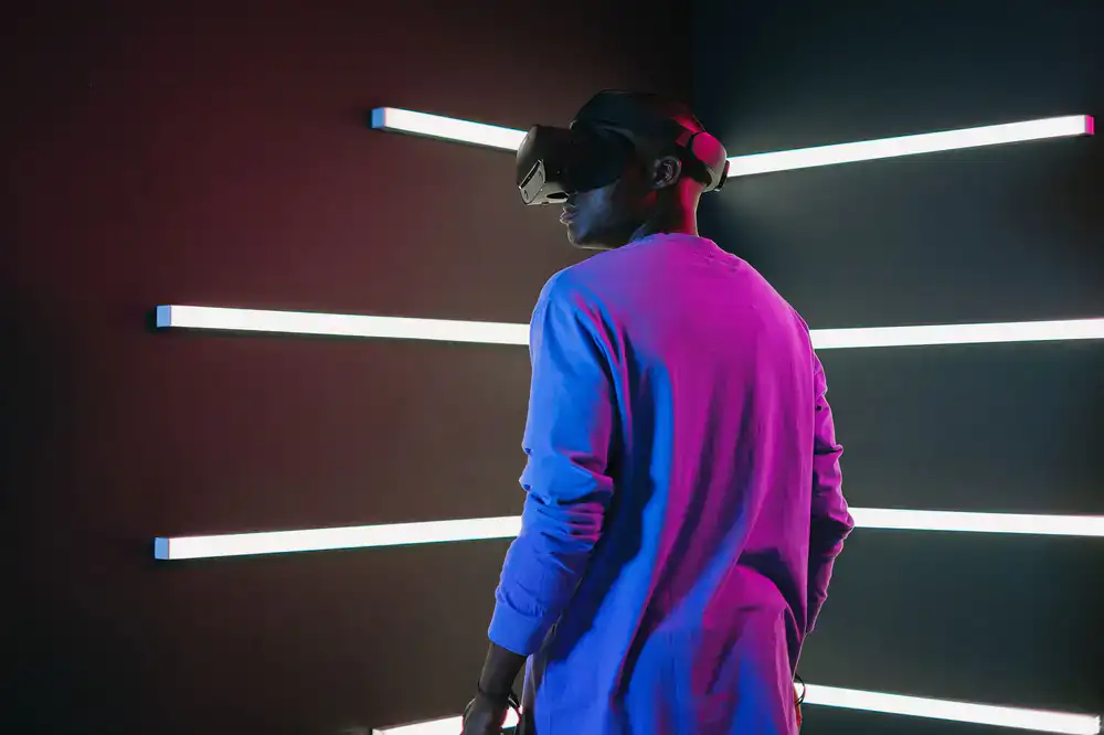 High-end VR headsets charging on a studio wall