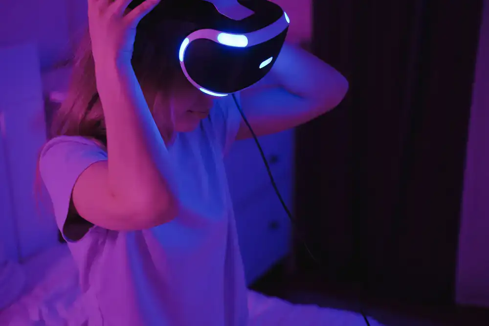 Person intensely working out in a neon-lit VR headset